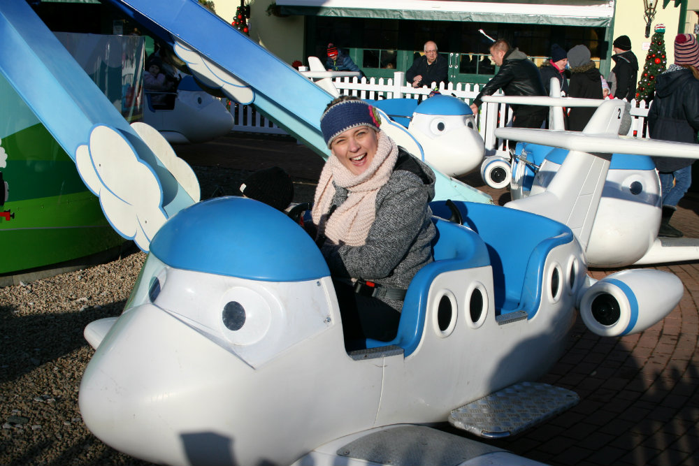 Surprised facial expression sat in the Jeremy Jet's Flying Academy ride