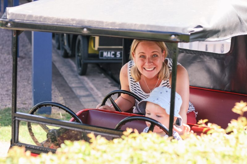Grinning on the driving ride at Thomasland