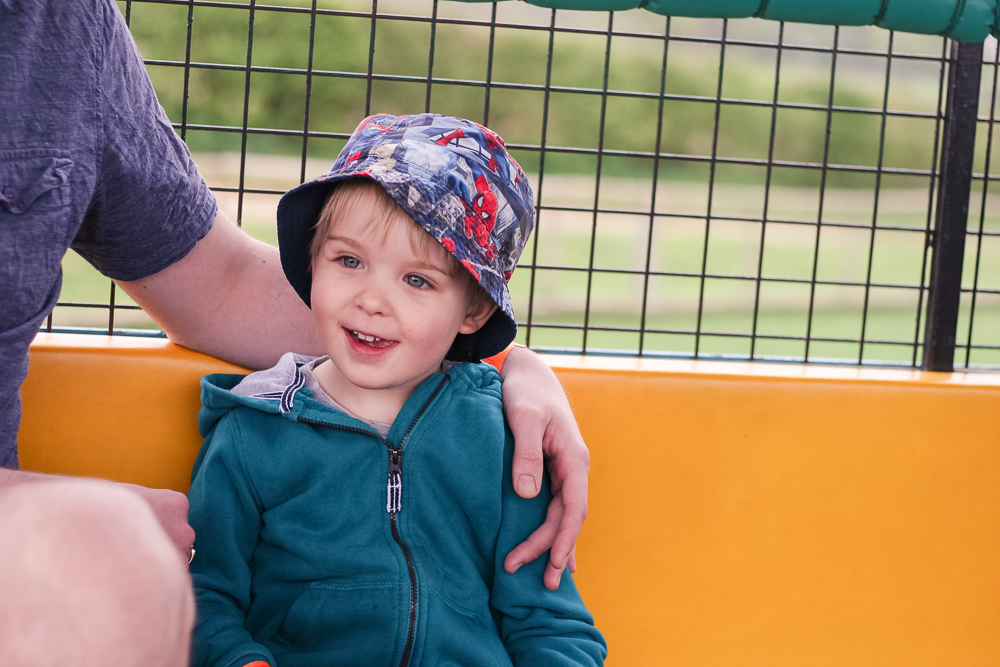 Daddy giving Pickle a cuddle on the Tractor Safari