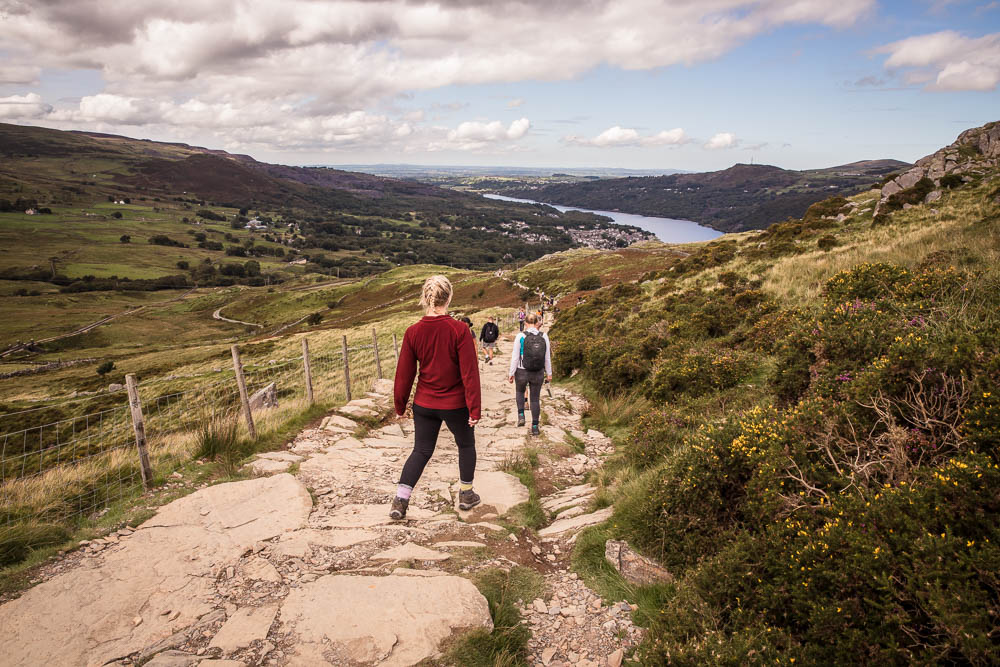 Walking down Snowdon Llanberis path wearing red fleece