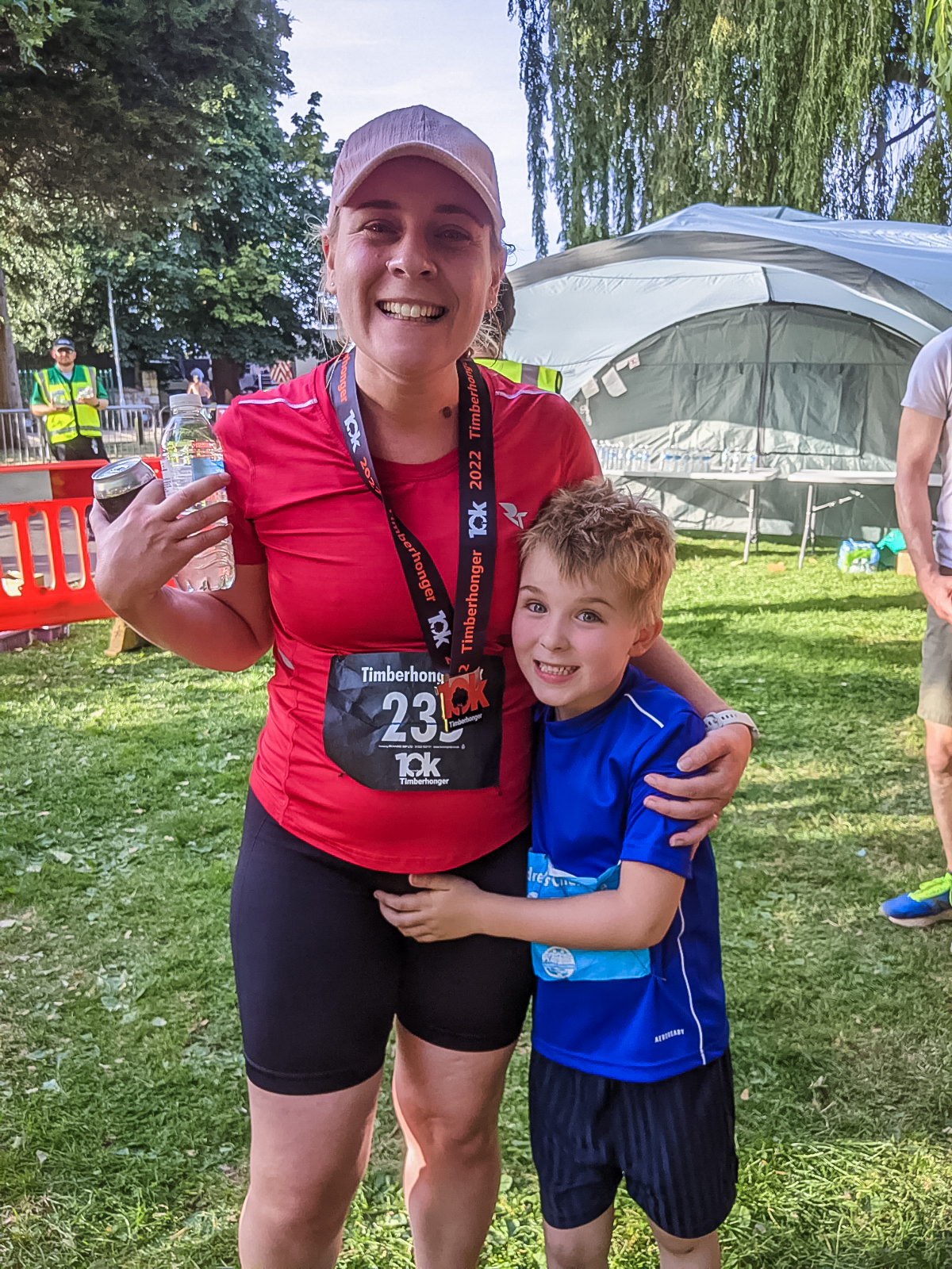 Holly and Pickle having a celebratory cuddle after running races in Bromsgrove