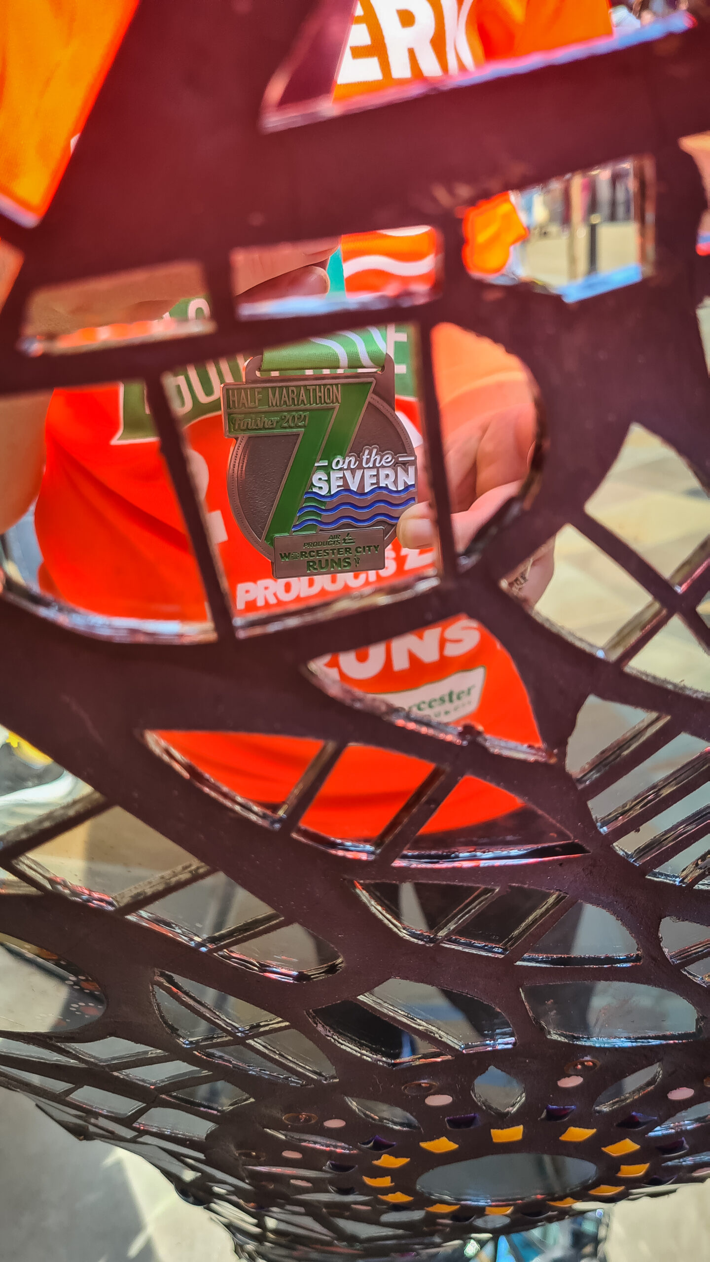 Worcester City Runs Half Marathon medal reflected in a mirrored Elephant