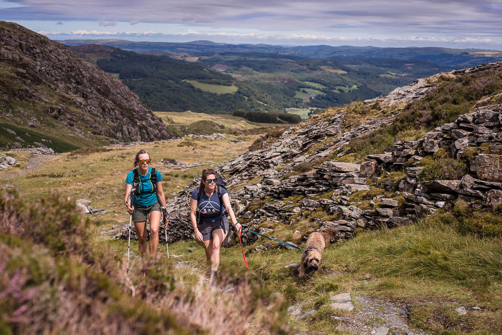 Bryony and Nic walking effortlessly up Moel Siabod in the July sunshine