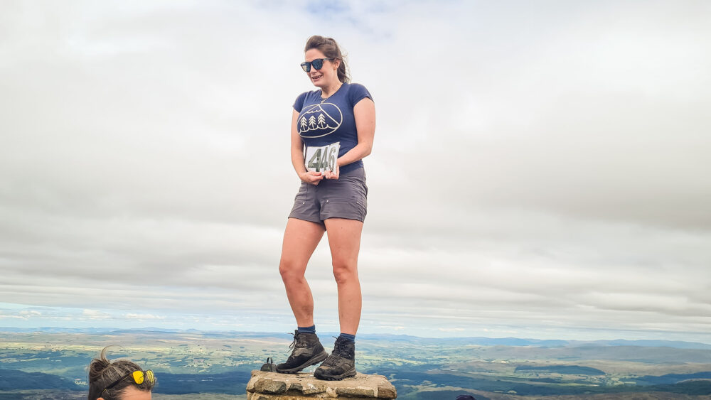 Bryony's summit photo with her numbers for the 446th mountain atop Moel Siabod